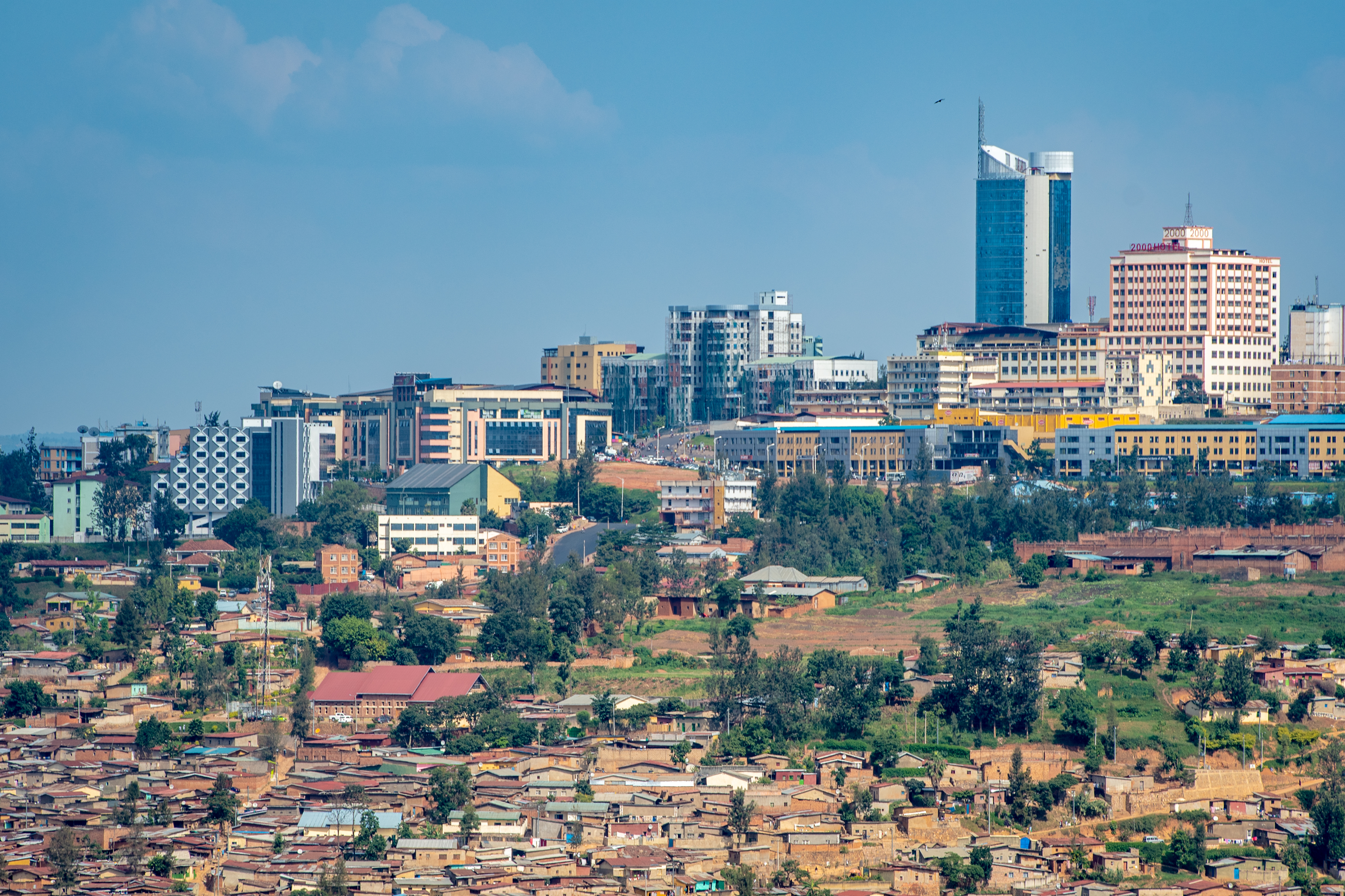 Der Wirtschaftsminister bestand darauf, dass Migranten sich freiwillig bereit erklärten, ihre Koffer zu packen und sich auf den Weg zum Urlaubsziel Kigali zu machen