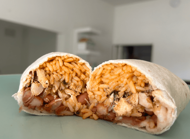 an el pollo loco burrito cut open on a countertop 